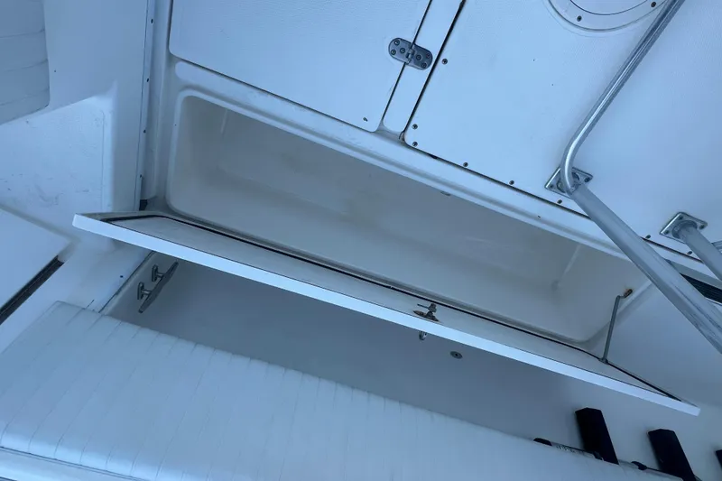 Slide: The Image of Open storage compartment on a 2006 Fountain 23 Center Console boat. - 21