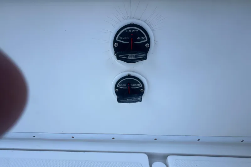 Slide: The Image of Boat control panel on a 2006 Fountain 23 Center Console, featuring switches and indicators. - 29