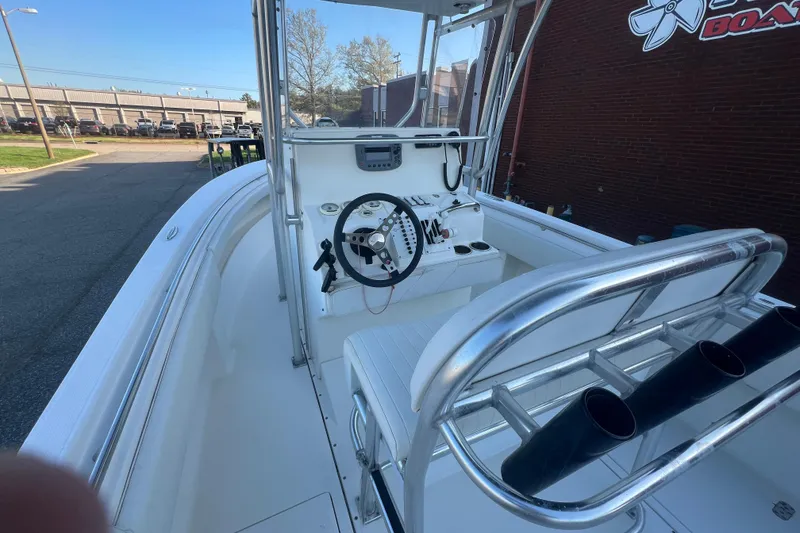 Slide: The Image of 2006 Fountain 23 Center Console boat interior with steering wheel and seating. - 30