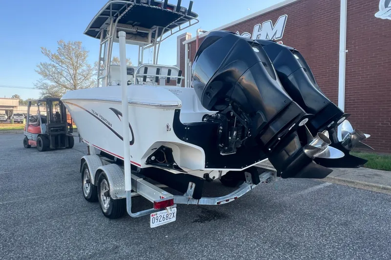 Slide: The Image of 2006 Fountain 23 Center Console boat on trailer with dual outboard motors. - 4