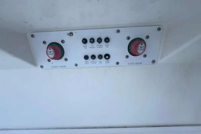 Slide: The Image of Control panel of a 2006 Fountain 23 Center Console boat with labeled switches and buttons. - 45