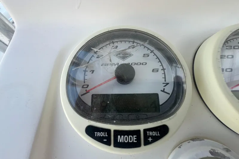 Slide: The Image of Close-up of a 2006 Fountain 23 Center Console tachometer gauge displaying RPM. - 48