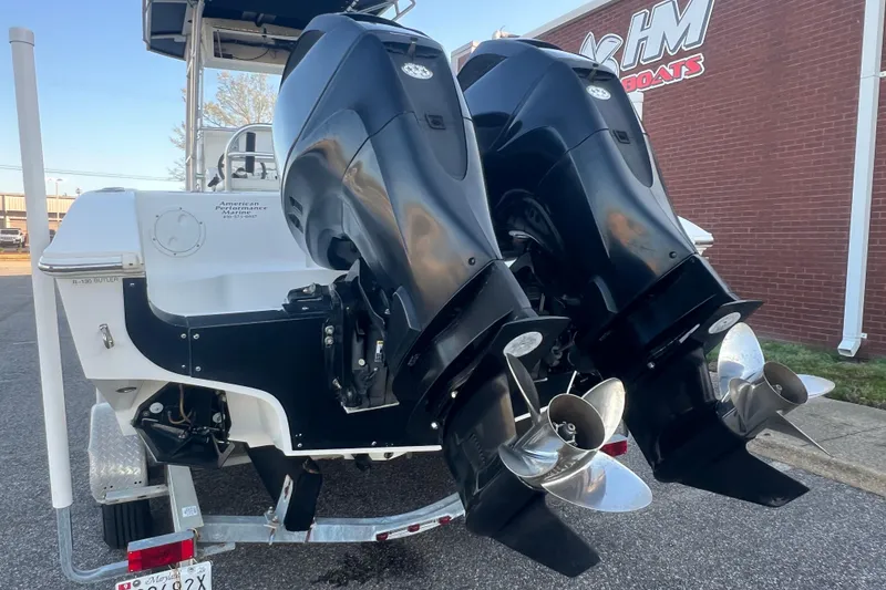 Slide: The Image of 2006 Fountain 23 Center Console boat with dual outboard motors on trailer. - 5