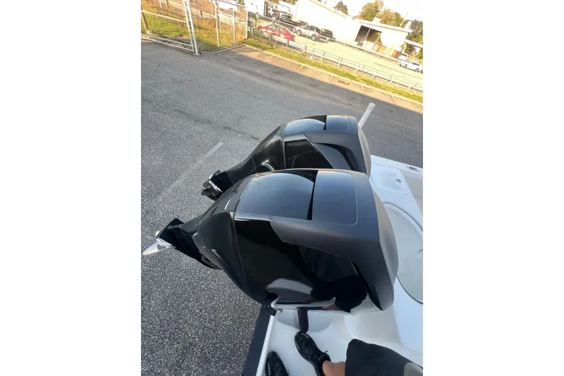 Slide: The Image of Twin outboard motors on a 2006 Fountain 23 Center Console boat. - 53