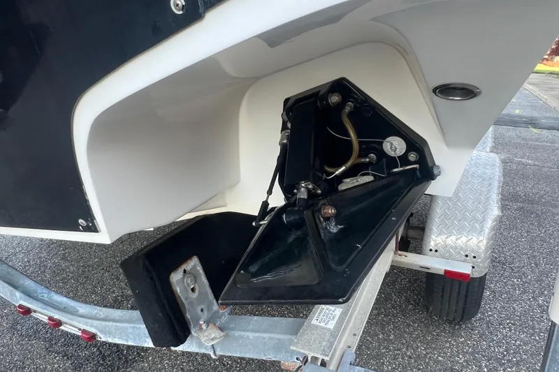 Slide: The Image of 2006 Fountain 23 Center Console boat on trailer, showing detailed hull and hardware. - 55