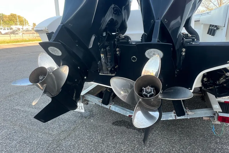 Slide: The Image of Twin propellers on a 2006 Fountain 23 Center Console boat, parked on a trailer. - 56