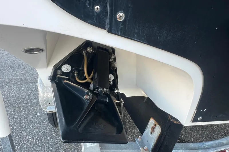 Slide: The Image of Close-up of a 2006 Fountain 23 Center Console boat's trim tab mechanism. - 58