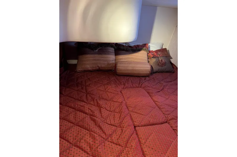 Slide: The Image of Luxurious cabin interior of 2006 Silverton 38 Sport Bridge with plush bedding. - 16