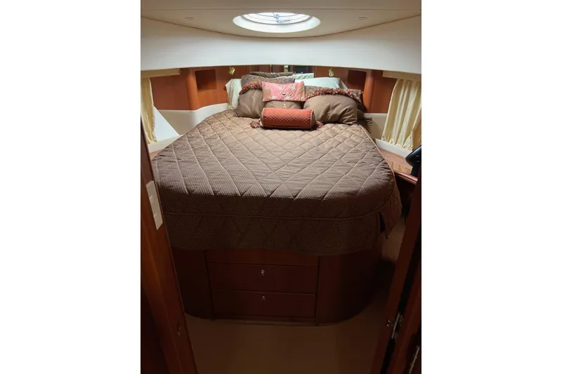 Slide: The Image of Luxurious cabin interior of 2006 Silverton 38 Sport Bridge yacht with cozy bedding. - 6
