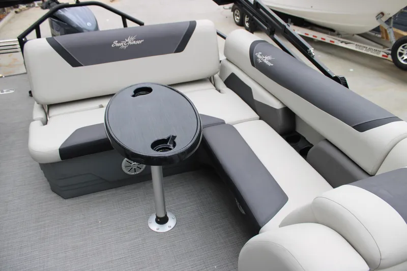 Slide: The Image of 2023 SunChaser Geneva Sport 23 SB boat interior with seating and table. - 10