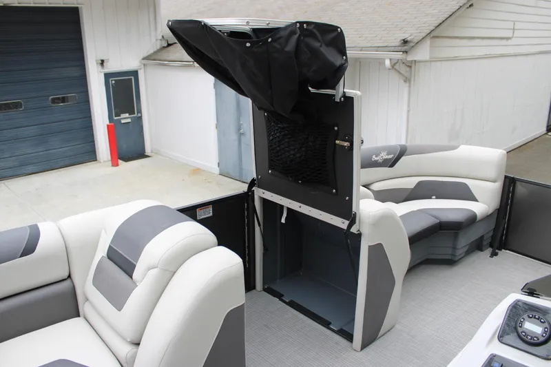 Slide: The Image of 2023 SunChaser Geneva Sport 23 SB pontoon boat interior with plush seating and storage. - 11