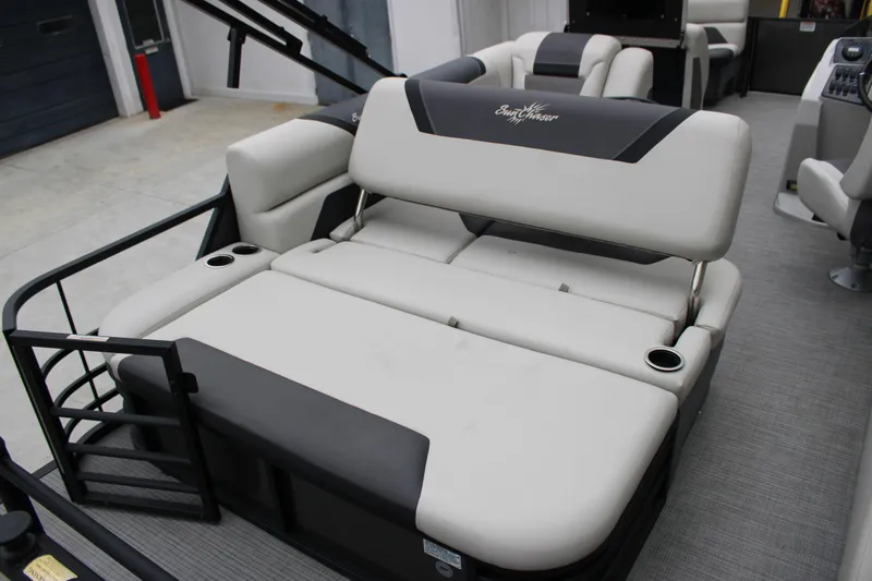 Slide: The Image of 2023 SunChaser Geneva Sport 23 SB boat interior with adjustable seating and cup holders. - 12