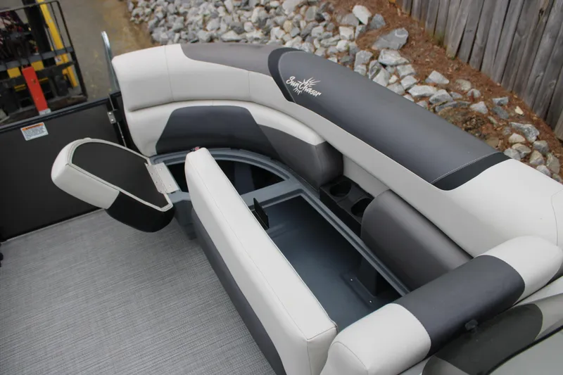 Slide: The Image of 2023 SunChaser Geneva Sport 23 SB boat interior with stylish seating and storage. - 7