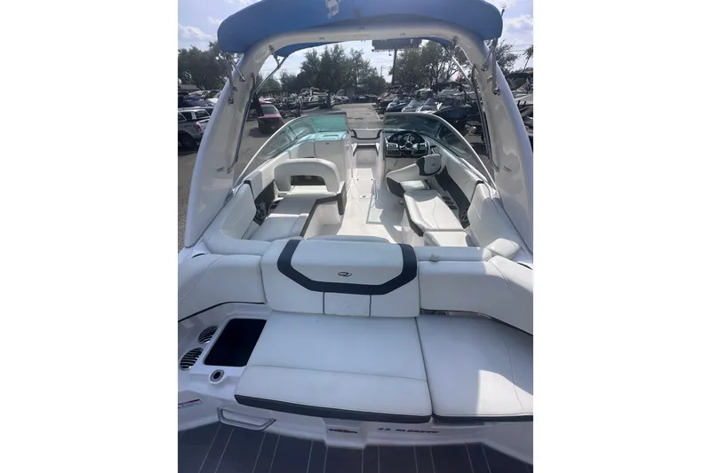 Slide: The Image of 2018 Regal 22 FasDeck boat interior with white seating and sleek design. - 13