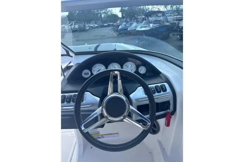 Slide: The Image of Steering wheel and dashboard of 2018 Regal 22 FasDeck boat. - 20