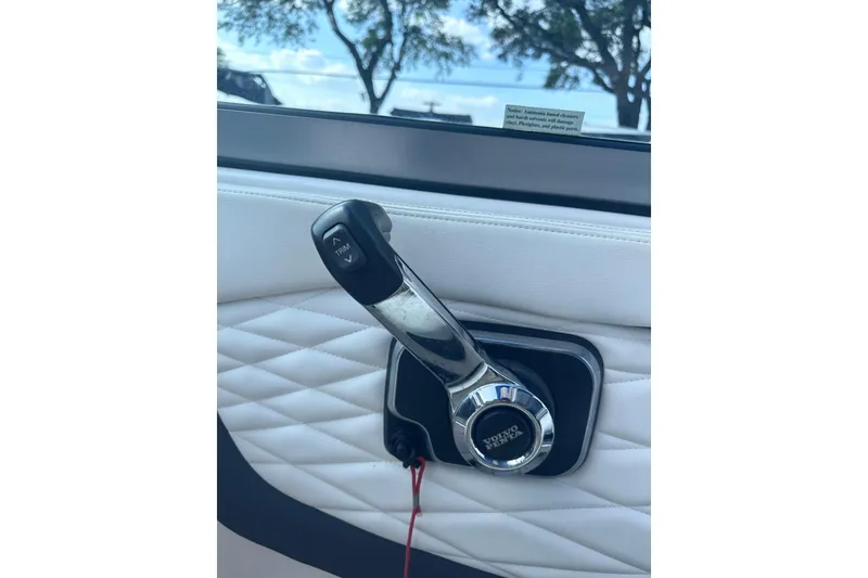 Slide: The Image of Throttle control lever on 2018 Regal 22 FasDeck boat, featuring Volvo Penta branding. - 21
