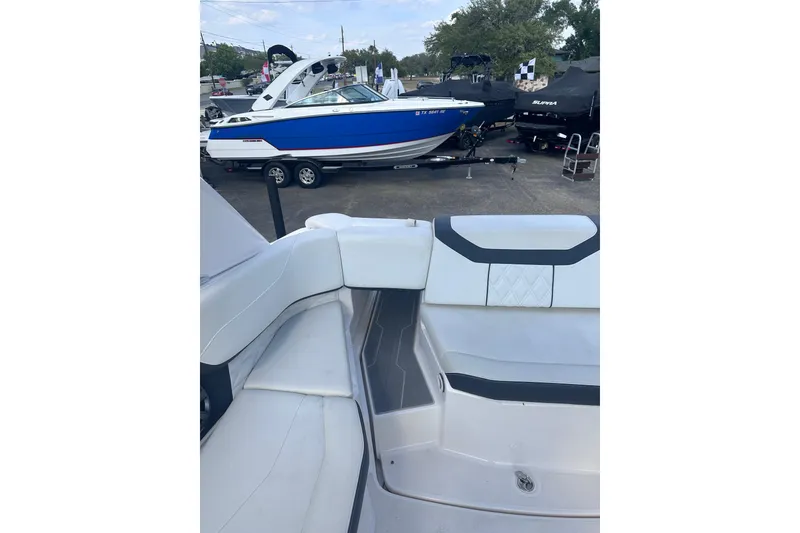 Slide: The Image of 2018 Regal 22 FasDeck boat interior with another boat in the background. - 25