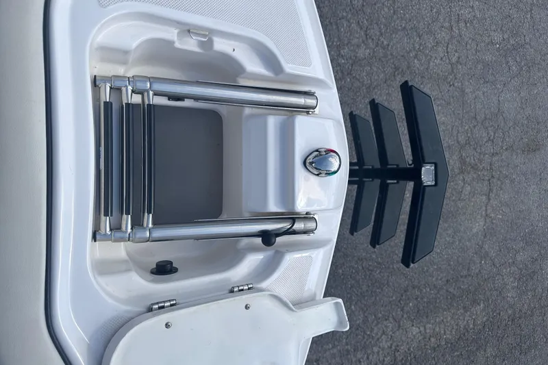 Slide: The Image of 2018 Regal 22 FasDeck boat ladder and anchor detail on deck. - 28