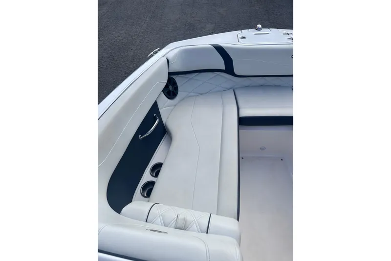 Slide: The Image of Interior seating of 2018 Regal 22 FasDeck boat with white and navy upholstery. - 30