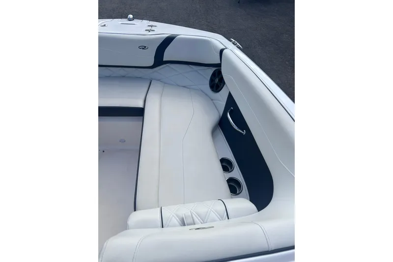Slide: The Image of Luxurious interior of a 2018 Regal 22 FasDeck boat with white seating and cup holders. - 31