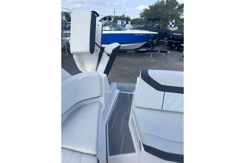 Slide: The Image of 2018 Regal 22 FasDeck boat interior with white seating and sleek design. - 32