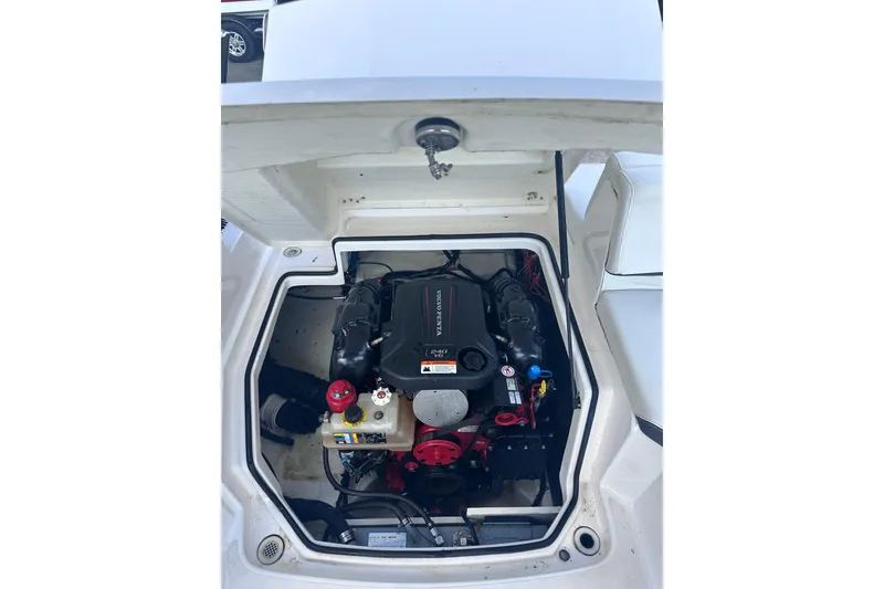 Slide: The Image of 2018 Regal 22 FasDeck boat engine compartment with Volvo Penta engine. - 35