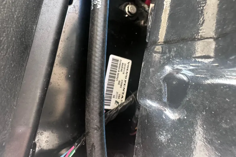 Slide: The Image of Close-up of a 2018 Regal 22 FasDeck engine compartment with visible label and wiring. - 41