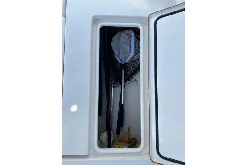 Slide: The Image of Storage compartment on a 2008 Contender 31 Tournament boat with fishing gear. - 13