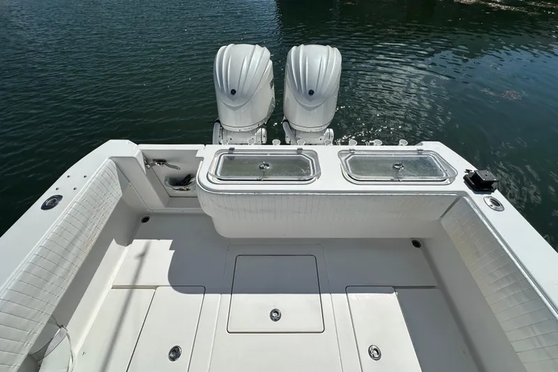 Slide: The Image of 2008 Contender 31 Tournament boat with dual engines on calm water. - 17