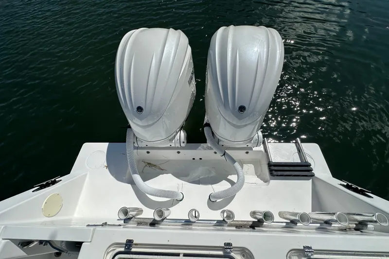 Slide: The Image of 2008 Contender 31 Tournament boat with dual outboard engines on water. - 18