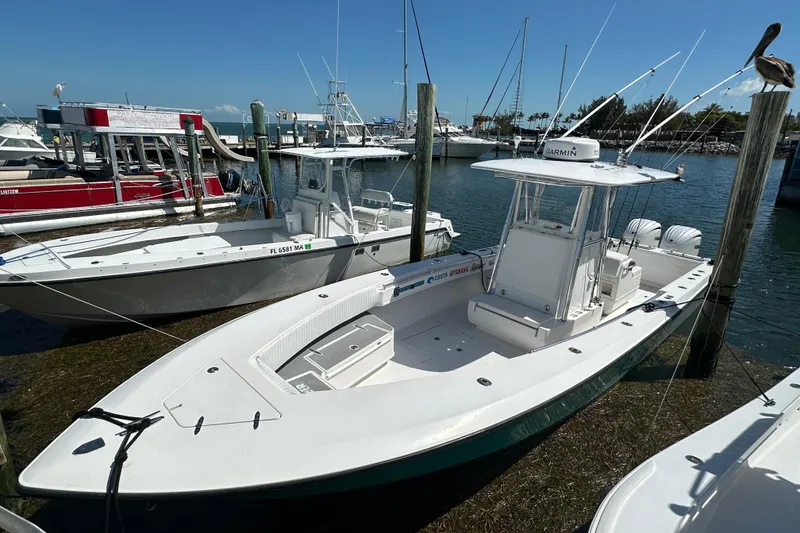 Slide: The Image of 2008 Contender 31 Tournament boat docked in a marina under clear blue skies. - 22