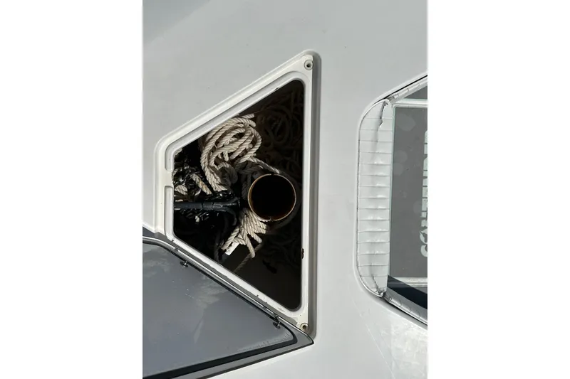 Slide: The Image of Open storage compartment on 2008 Contender 31 Tournament boat with ropes inside. - 24