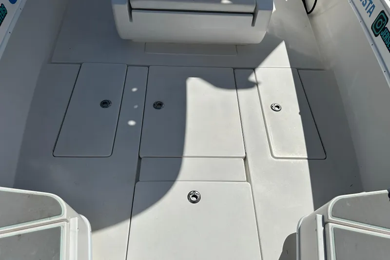 Slide: The Image of 2008 Contender 31 Tournament boat deck with storage compartments and seating. - 6