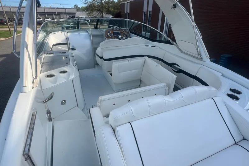 Slide: The Image of 2008 Formula 310 Sun Sport boat interior with white seating and dashboard. - 11