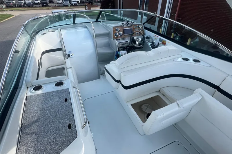 Slide: The Image of 2008 Formula 310 Sun Sport boat interior with white seating and modern dashboard. - 12