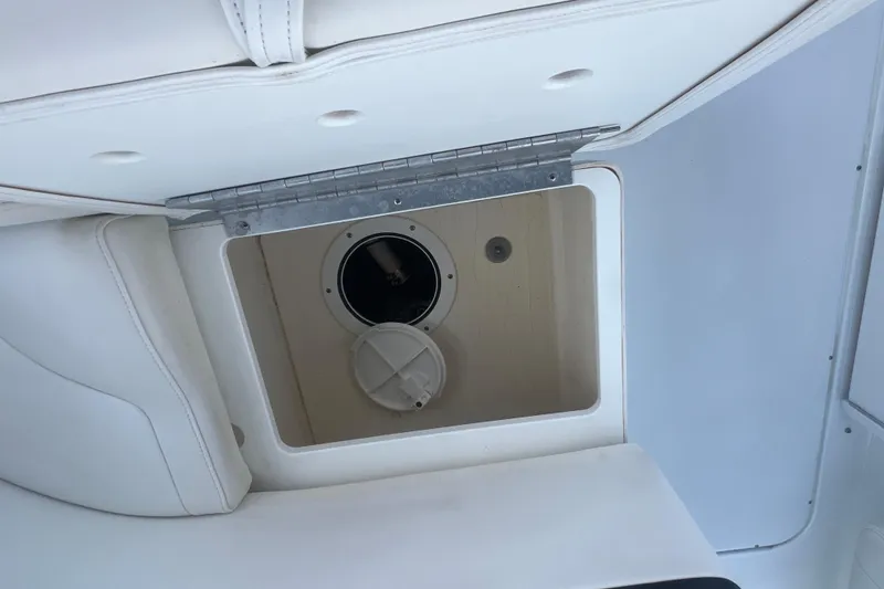 Slide: The Image of Hatch opening on a 2008 Formula 310 Sun Sport boat, showcasing interior compartment. - 13