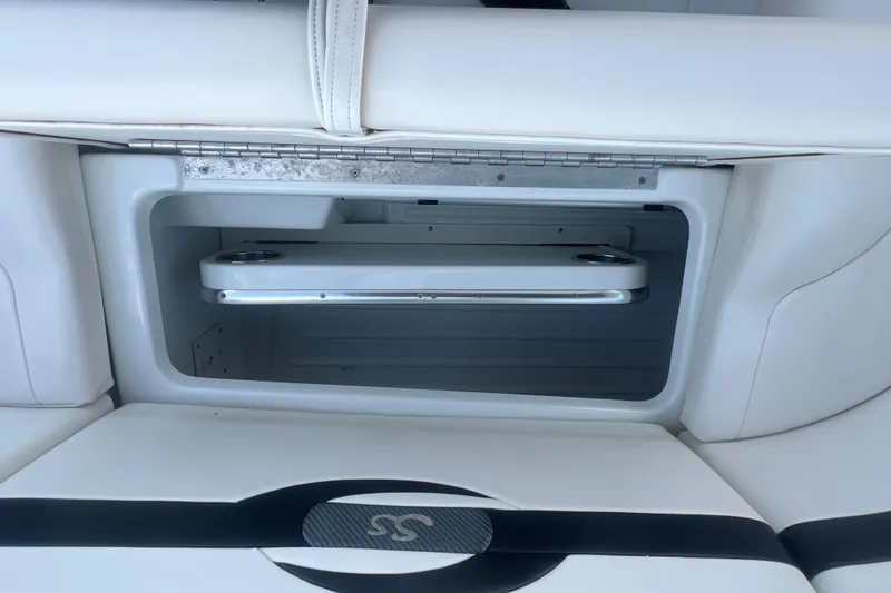 Slide: The Image of Storage compartment in a 2008 Formula 310 Sun Sport boat, featuring sleek white interior design. - 14