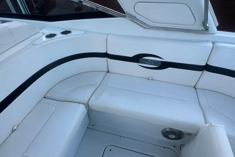 Slide: The Image of 2008 Formula 310 Sun Sport boat interior with white seating and cup holders. - 15