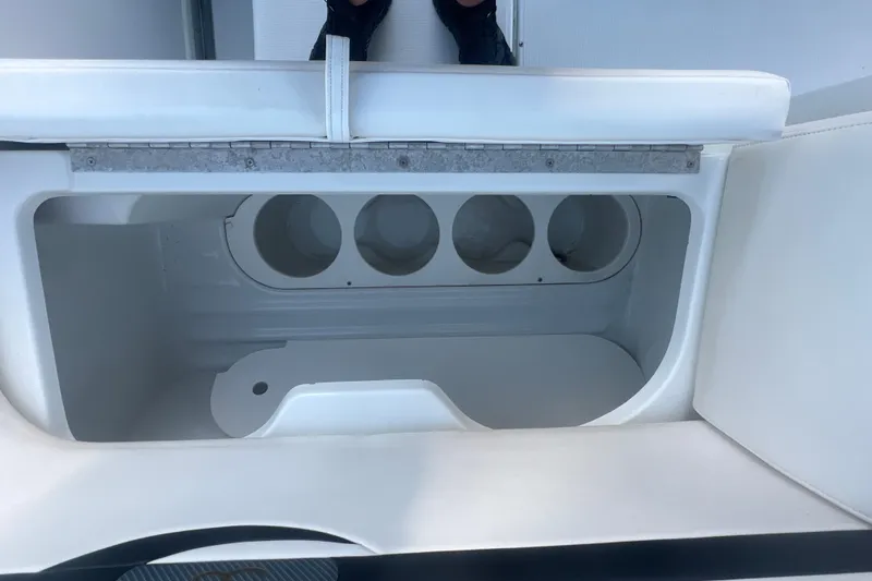 Slide: The Image of Storage compartment on a 2008 Formula 310 Sun Sport boat with cup holders. - 23