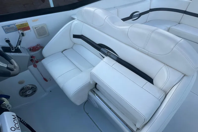 Slide: The Image of 2008 Formula 310 Sun Sport boat interior with white leather seating and control panel. - 26