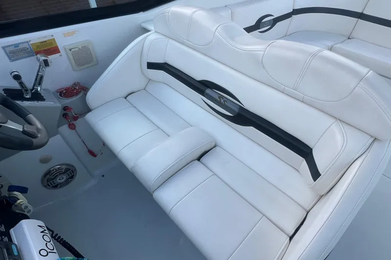 Slide: The Image of 2008 Formula 310 Sun Sport boat interior with white leather seating and control panel. - 27
