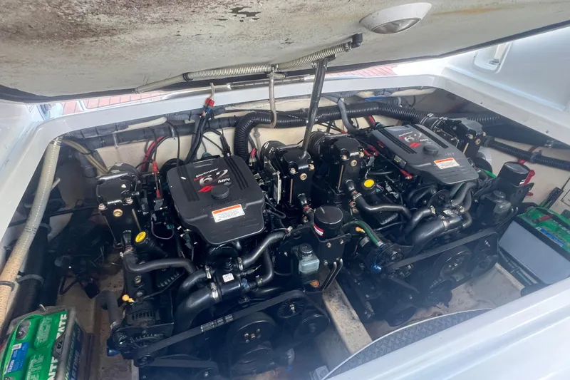 Slide: The Image of Engine compartment of a 2008 Formula 310 Sun Sport boat, featuring dual MerCruiser engines. - 31