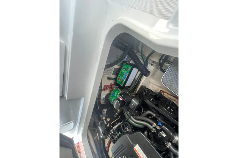 Slide: The Image of Engine compartment of a 2008 Formula 310 Sun Sport boat, showcasing mechanical components. - 35