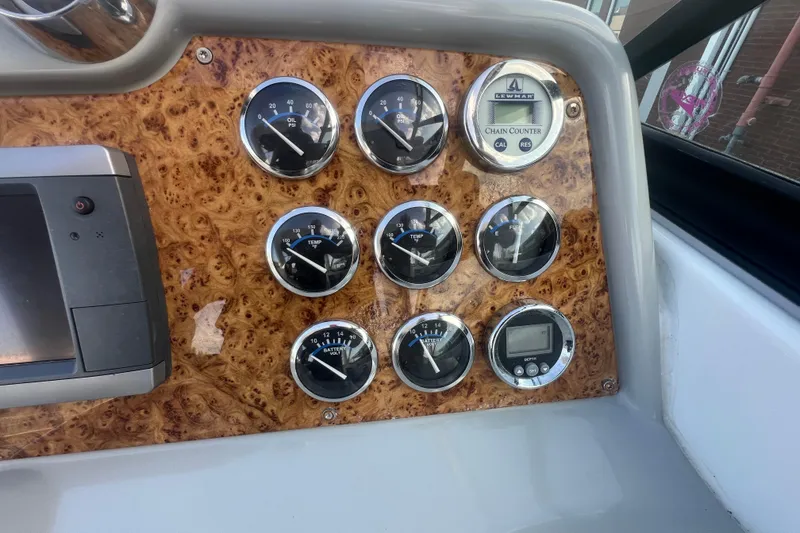 Slide: The Image of Dashboard of a 2008 Formula 310 Sun Sport boat with gauges and controls. - 41
