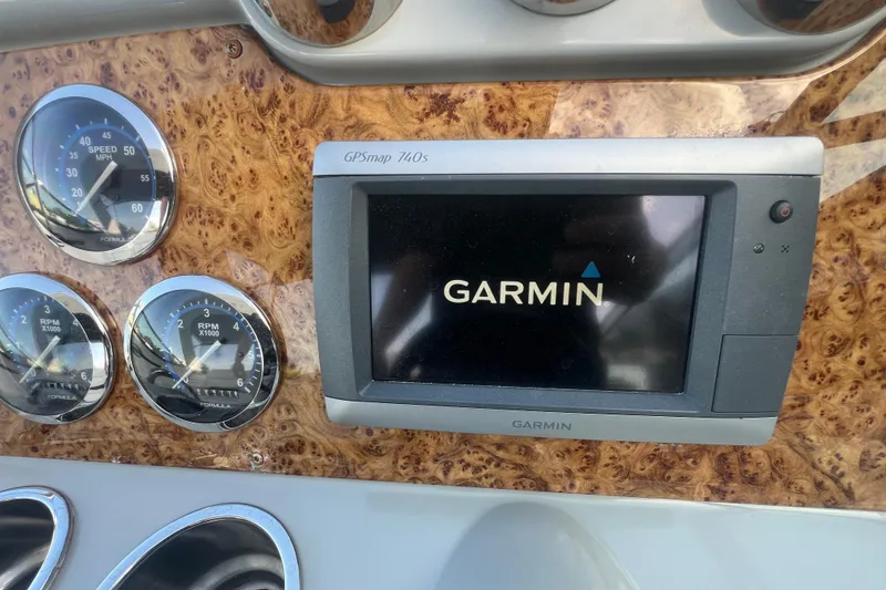 Slide: The Image of Dashboard of 2008 Formula 310 Sun Sport with Garmin GPS and analog gauges. - 42