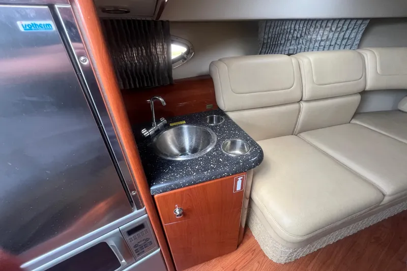 Slide: The Image of Interior of 2008 Formula 310 Sun Sport with kitchenette and beige seating. - 44