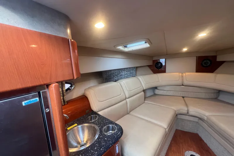 Slide: The Image of Luxurious interior of 2008 Formula 310 Sun Sport boat with plush seating and kitchenette. - 50