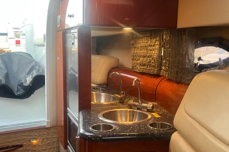 Slide: The Image of Interior of 2008 Formula 310 Sun Sport boat with kitchenette and seating area. - 54