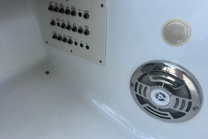 Slide: The Image of Control panel and speaker on 2008 Formula 310 Sun Sport boat interior. - 56