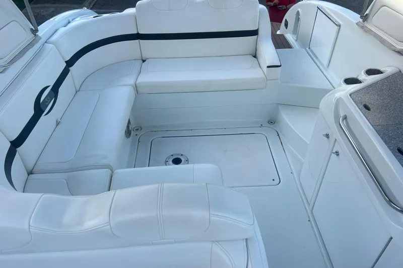 Slide: The Image of 2008 Formula 310 Sun Sport boat interior with white seating and sleek design. - 58